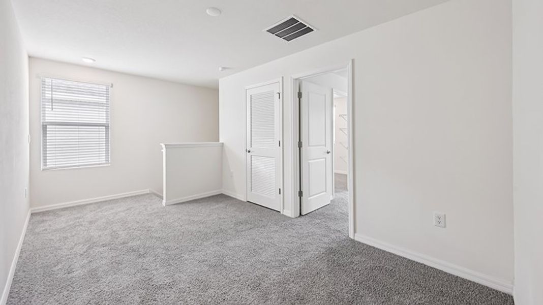 Representative unfurnished interior of a home built from the ROBIE by D.R. Horton in Oaks Preserve, Gainesville (Image 22).