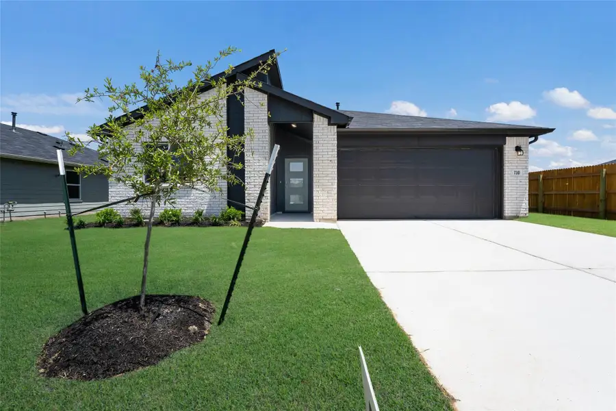 Front exterior of a new home in Southgrove, Kyle, TX, highlighting curb appeal (Image 1). Front exterior of a new home in Southgrove, Kyle, TX, highlighting curb appeal (Image 1).