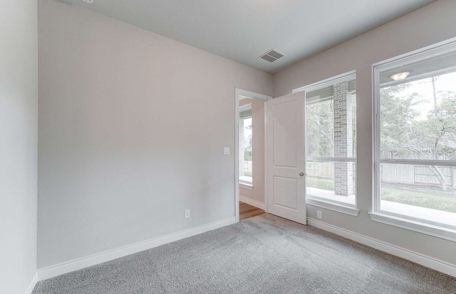 Representative unfurnished interior of a home built from the 3049 by Ravenna Homes in The Woodlands Hills 65′, Willis (Image 37). Representative unfurnished interior of a home built from the 3049 by Ravenna Homes in The Woodlands Hills 65′, Willis (Image 37).