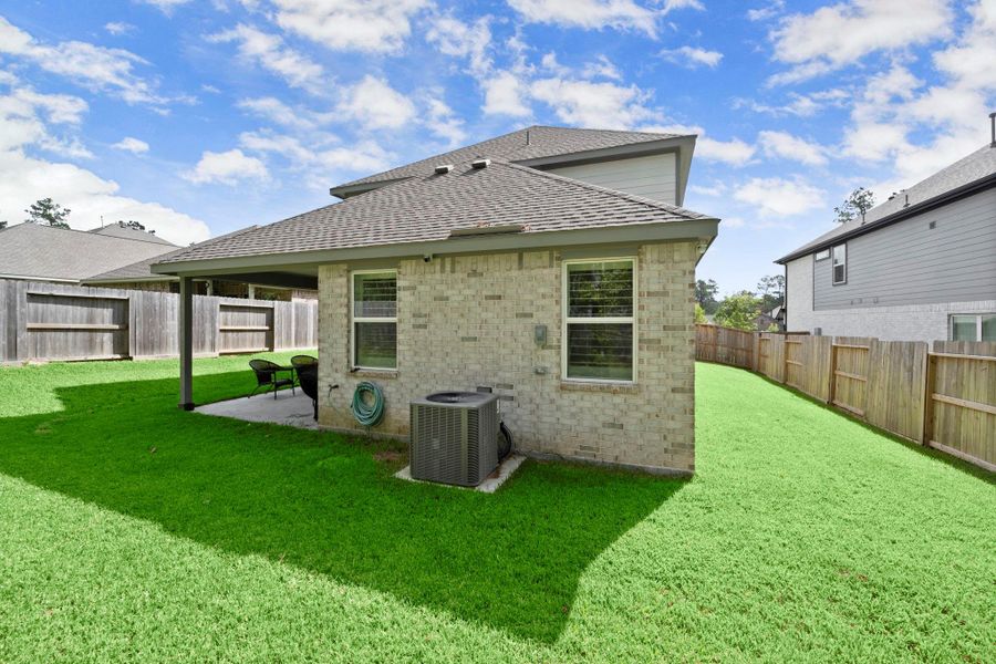 Exterior details and patio area of a home in , Conroe (Image 1). Exterior details and patio area of a home in , Conroe (Image 1).
