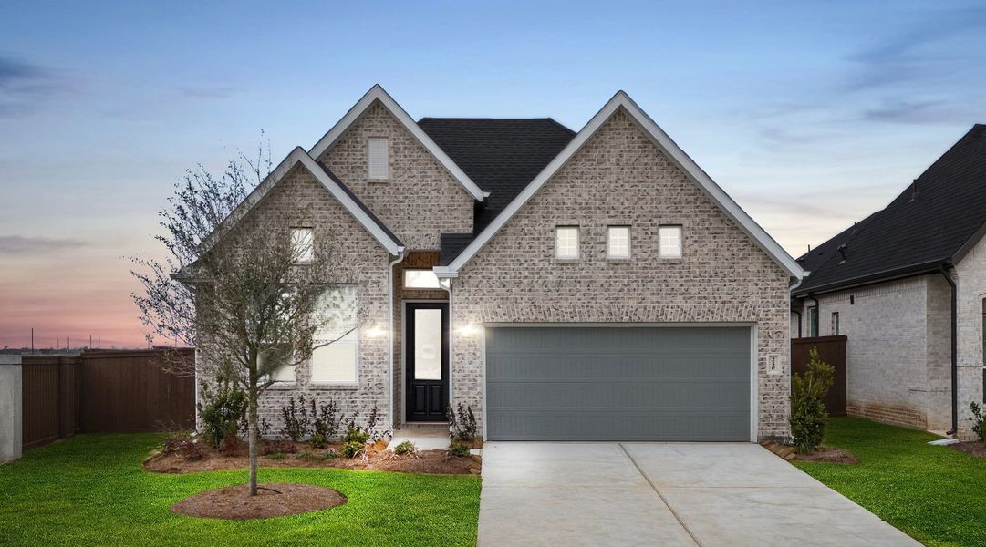 Front exterior of a new home in Brookewater, Rosenberg, TX, highlighting curb appeal (Image 2). Front exterior of a new home in Brookewater, Rosenberg, TX, highlighting curb appeal (Image 2).