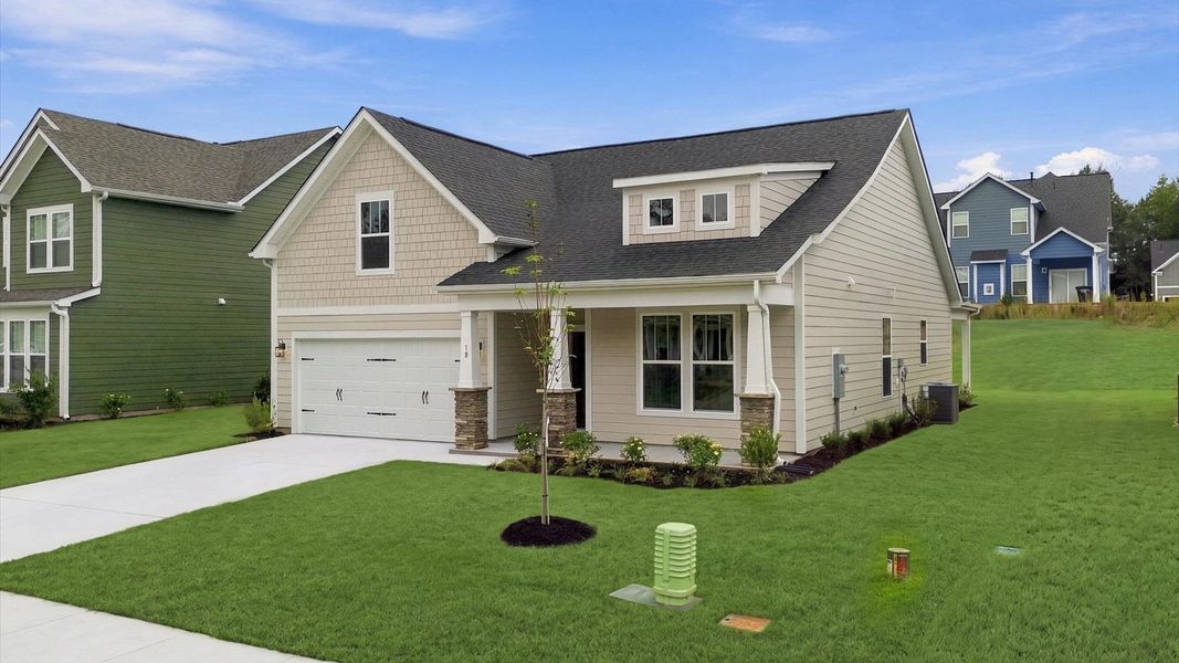 Refined exterior design with balanced architectural detail in this distinguished two-story home by DRB Homes