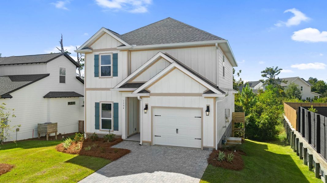 Front exterior of a new home in Sanctuary Beach, Panama City Beach, FL, highlighting curb appeal (Image 1).