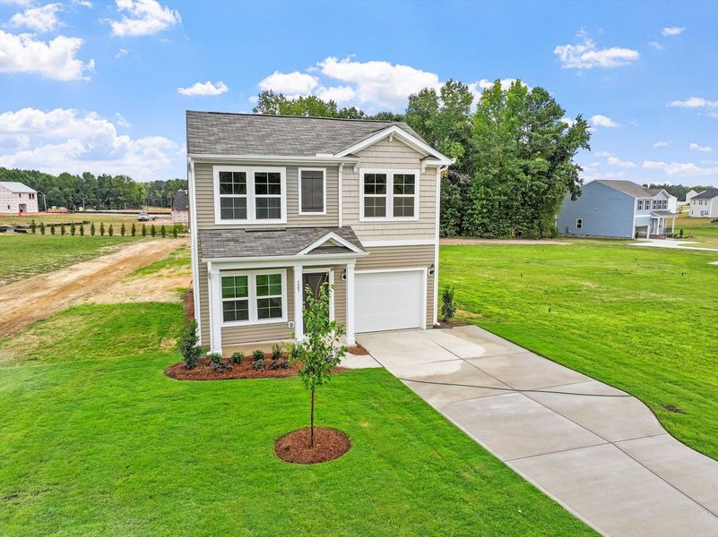 Front exterior of a new home in Cambridge Reserve, Angier, NC, highlighting curb appeal (Image 19).