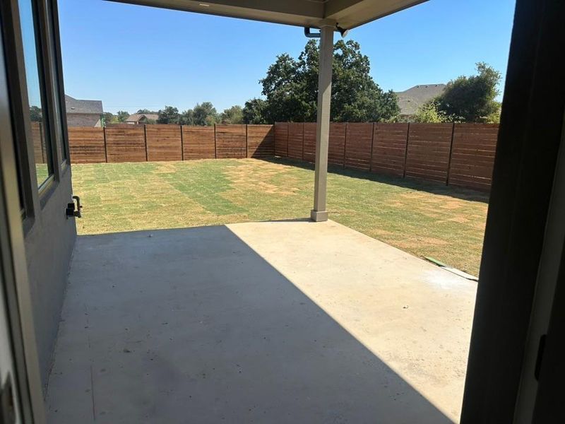 Fenced backyard featuring a patio Fenced backyard featuring a patio