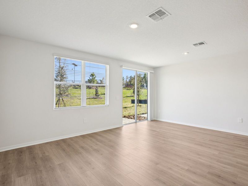 Spacious, unfurnished interior of a new home in The Reserve at Hammock Oaks Townes, Lady Lake (Image 8).