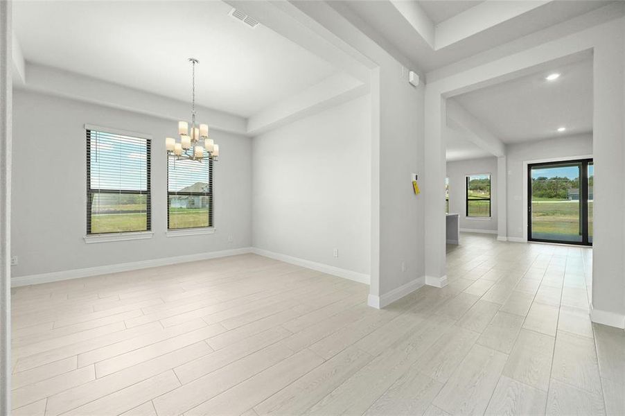 Dining Room With wood Tile flooring throughout