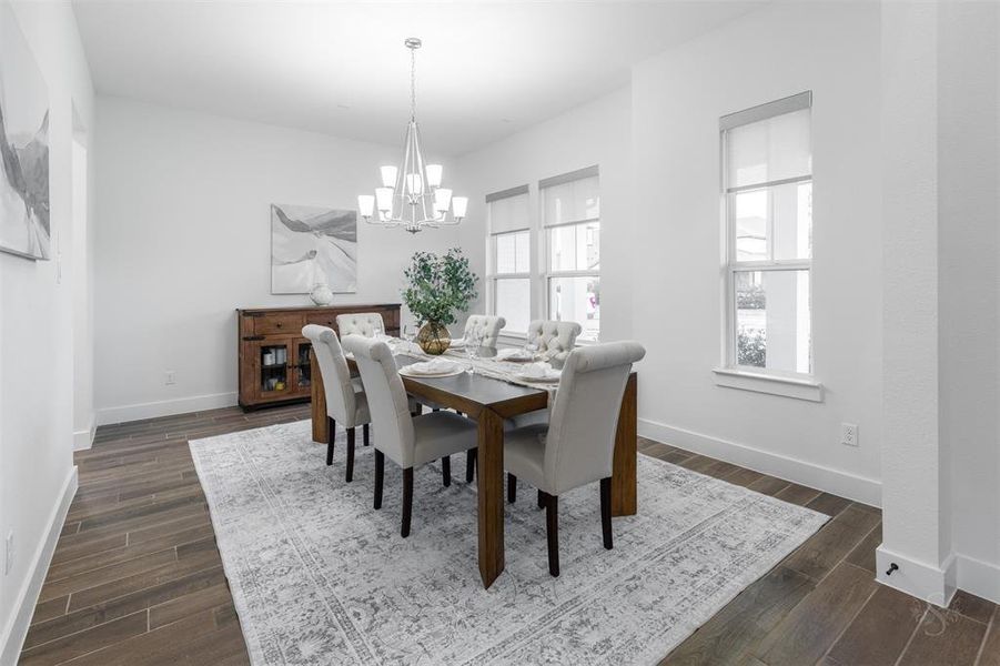 The dining room overlooks the front porch and front yard.  The windows in this room, as well as throughout the rest of the house are electronically operated window shades. As much light in as you want.  Privacy for evenings.