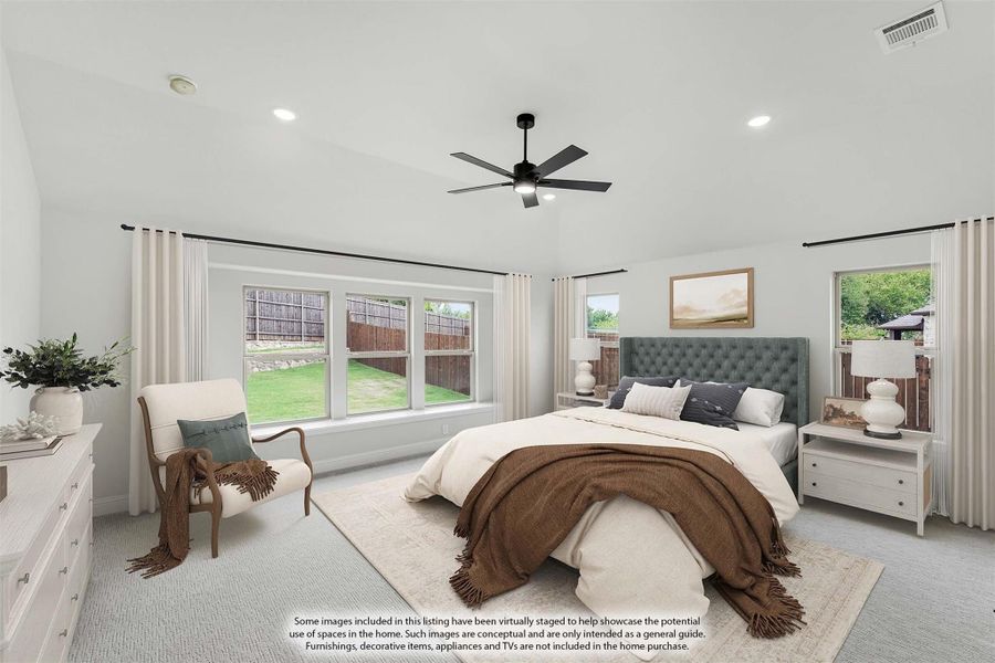 Spacious master bedroom with vaulted ceiling, ceiling fan, large windows, and neutral carpet flooring Spacious master bedroom with vaulted ceiling, ceiling fan, large windows, and neutral carpet flooring