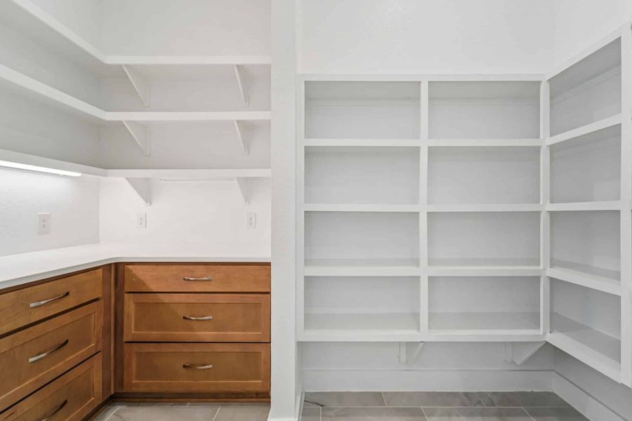 Representative furnished interior of a home built from the Lauren by Chesmar Homes in University Heights, Round Rock (Image 7).