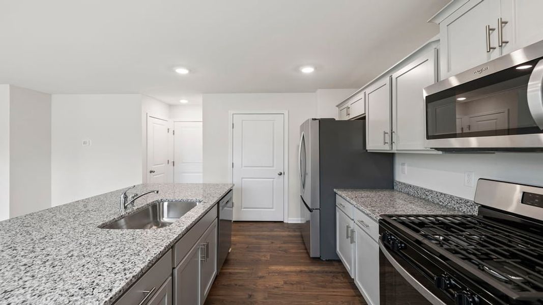 Furnished interior view inside a new home in Lakestone, Woodruff (Image 9).