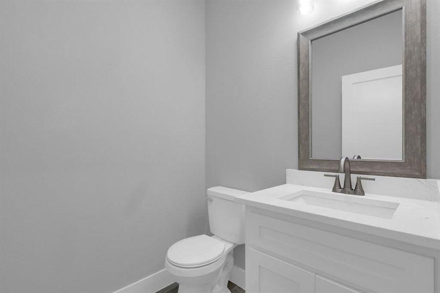 Bathroom featuring vanity and toilet