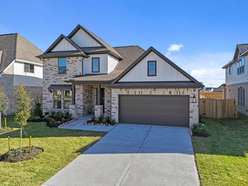 Front exterior of a new home in The Meadows at Imperial Oaks 60', Conroe, TX, highlighting curb appeal (Image 22).