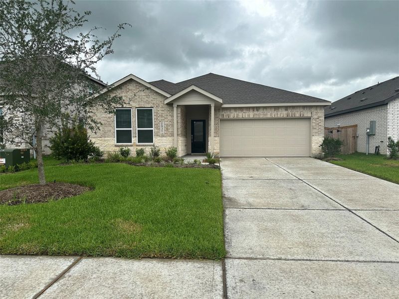 Front exterior of a new home in Windrose Green, Angleton, TX, highlighting curb appeal (Image 1). Front exterior of a new home in Windrose Green, Angleton, TX, highlighting curb appeal (Image 1).