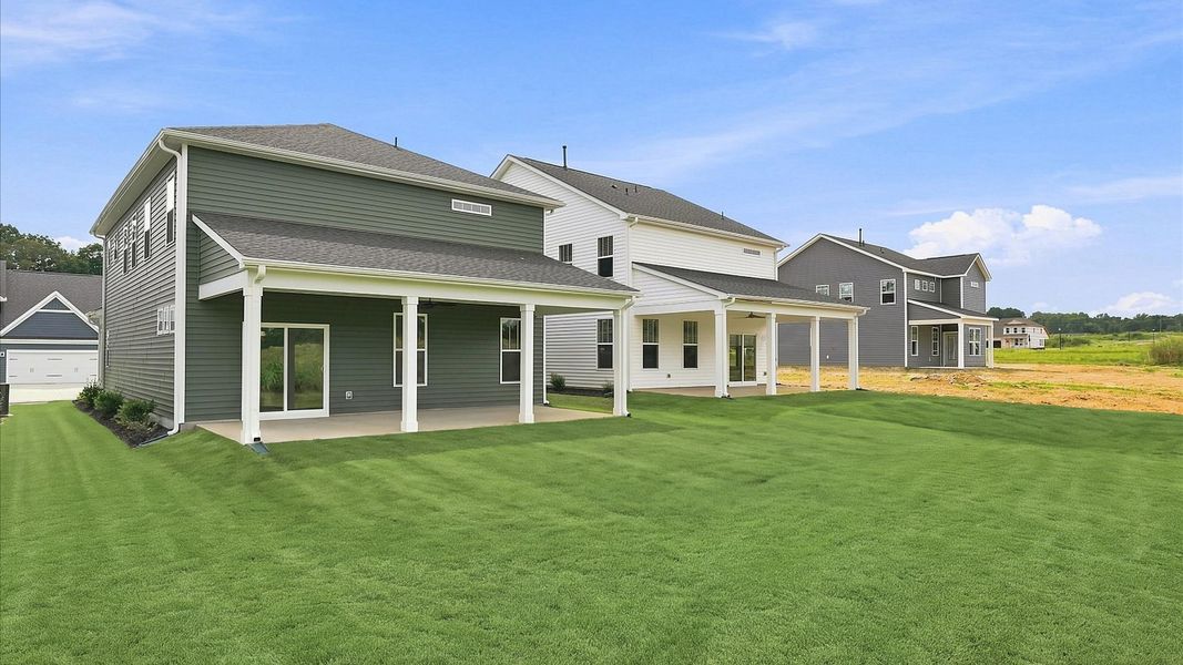 Refined rear exterior with a stylish covered porch for dining, relaxing, or entertaining Refined rear exterior with a stylish covered porch for dining, relaxing, or entertaining