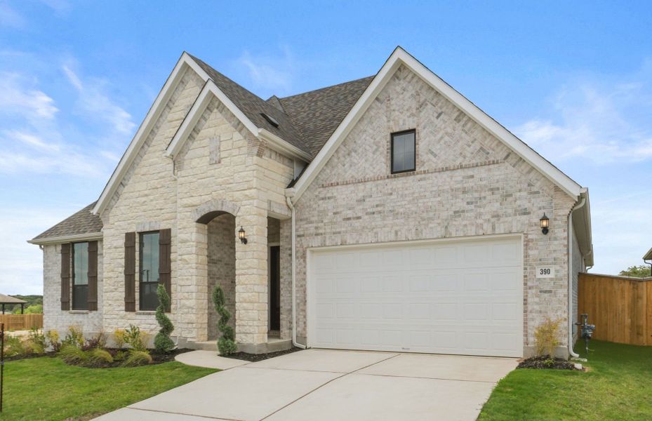 Front exterior of a new home in 6 Creeks, Kyle, TX, highlighting curb appeal (Image 30). Front exterior of a new home in 6 Creeks, Kyle, TX, highlighting curb appeal (Image 30).