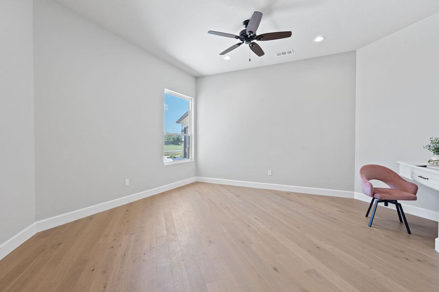 Spare room featuring ceiling fan, light wood-style floors, and recessed lighting