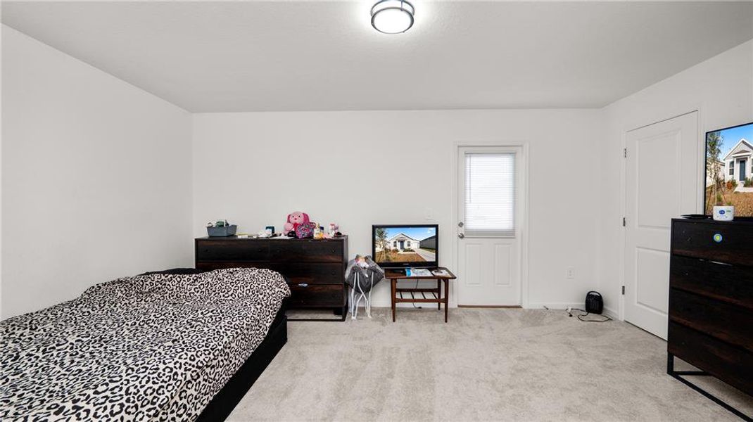 Furnished interior view inside a new home in Peace Creek Reserve: Legacy Collection, Winter Haven (Image 16).