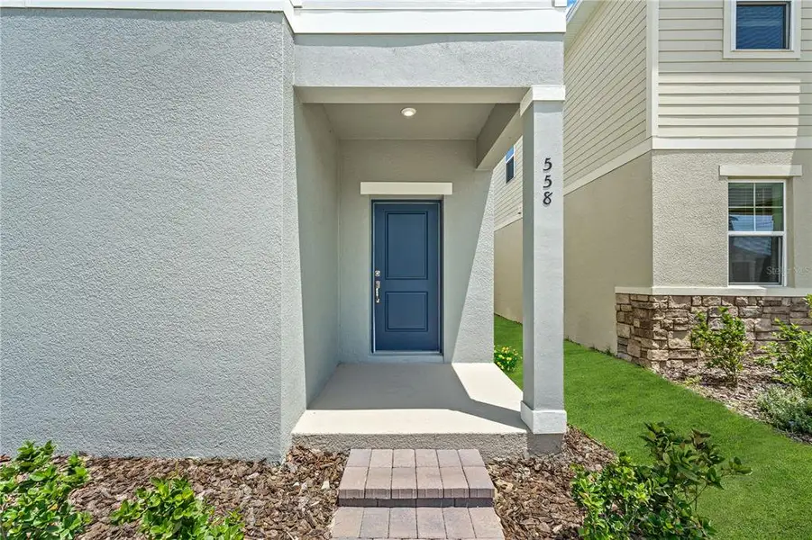 Exterior details and patio area of a home in Brack Ranch, St. Cloud (Image 3).
