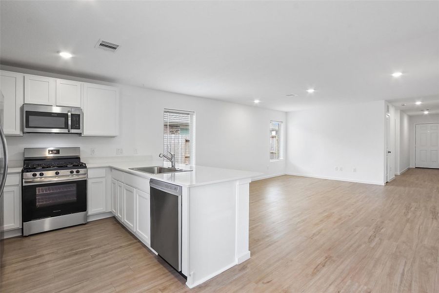 Gourmet Kitchen with Stainless Steel Appliances.
