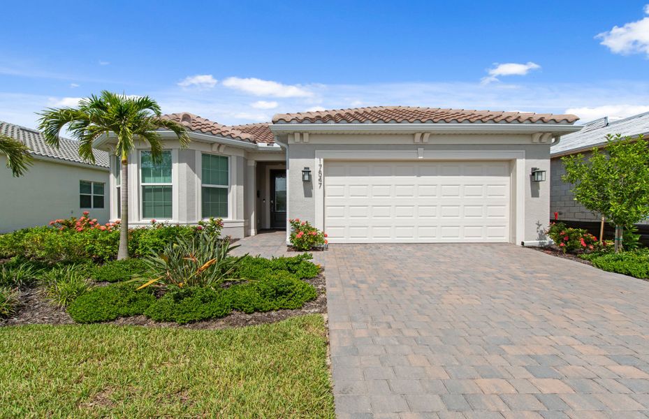 Representative exterior photo of a completed home built from the Prosperity by Del Webb in Del Webb Oak Creek, North Fort Myers, FL (Image 19).