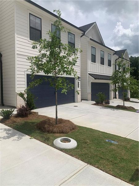 Front exterior of a new home in The Reserve at Gainesville Township, Gainesville, GA, highlighting curb appeal (Image 1).