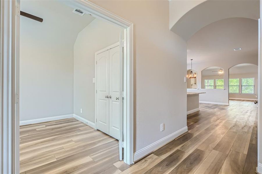 Hall with hardwood / wood-style floors