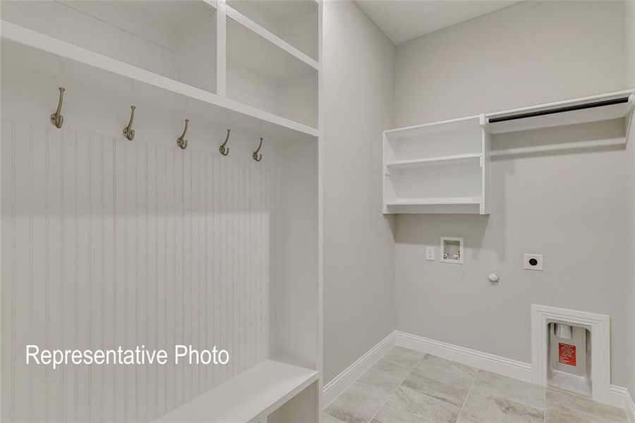 Laundry area featuring hookup for an electric dryer, washer hookup, and gas dryer hookup