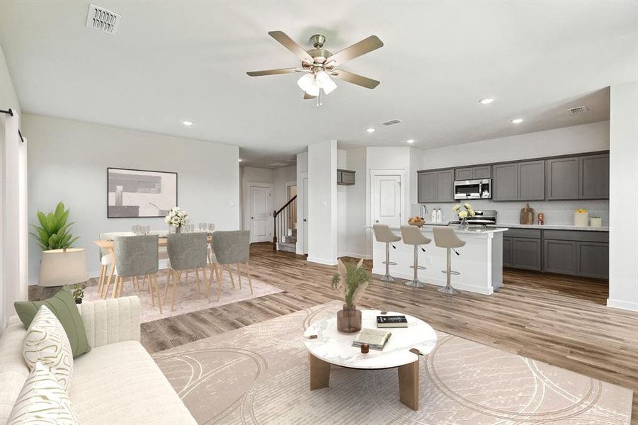 Living room featuring light hardwood / wood-style flooring and ceiling fan