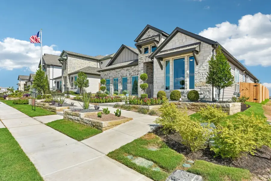Representative exterior photo of a completed home built from the Enfield by Taylor Morrison in Eastwood, Manor, TX (Image 23).