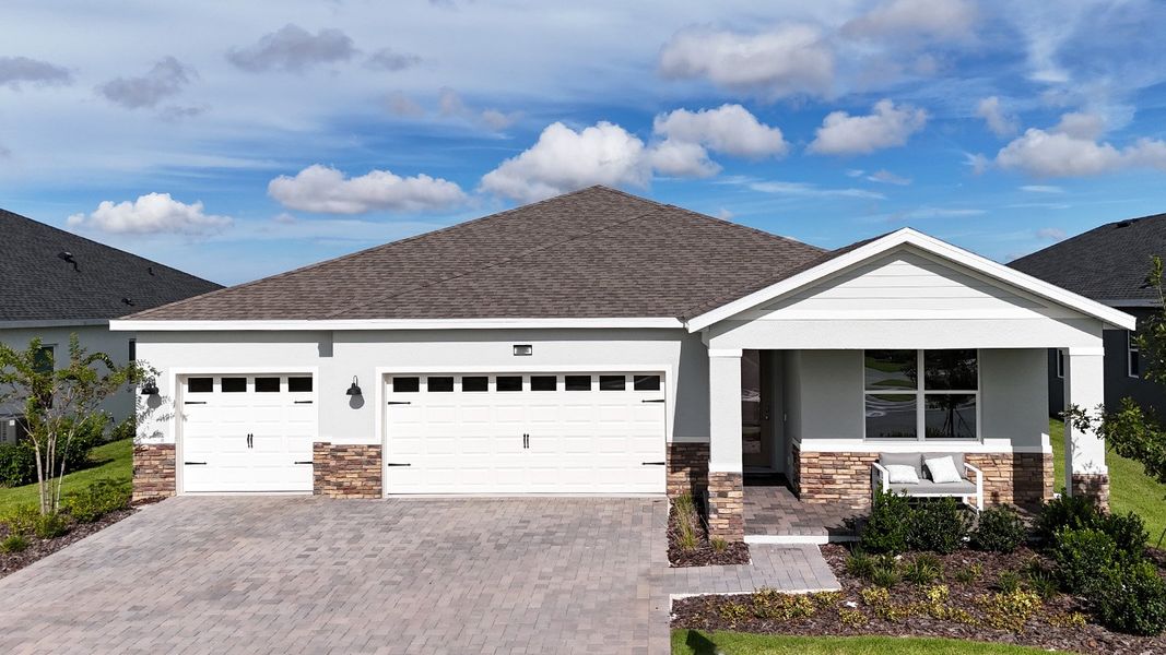 Representative exterior photo of a completed home built from the DENHAM by D.R. Horton in Lakes of Mount Dora, Mount Dora, FL (Image 1).