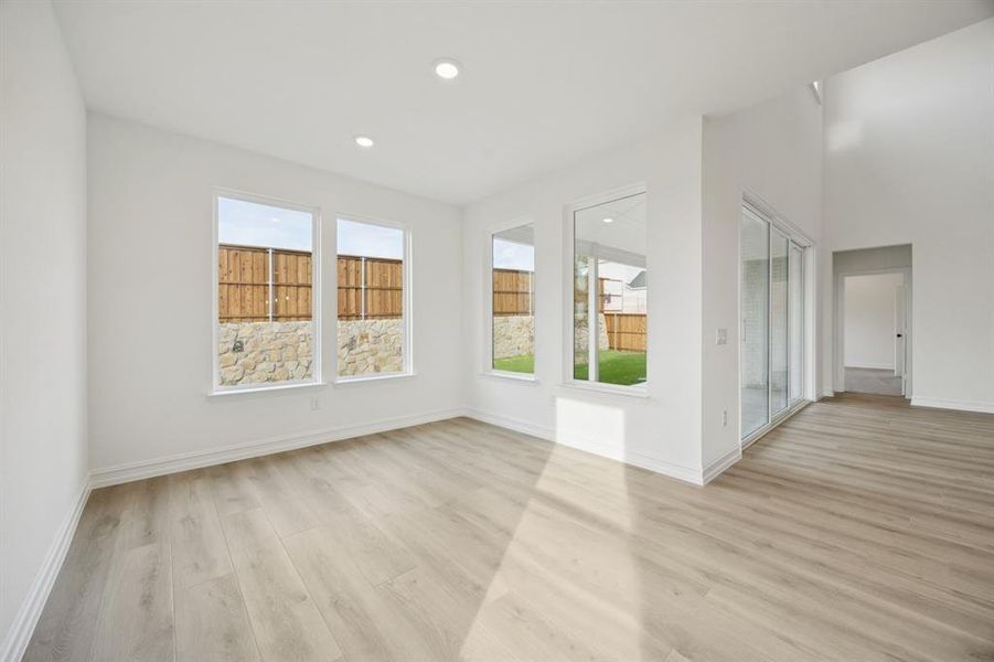 Dining nook off kitchen with large windows. *Model representation.