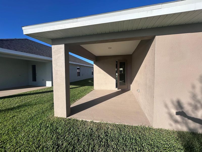 Exterior details and patio area of a home in Waterstone 52, Fort Pierce (Image 17).