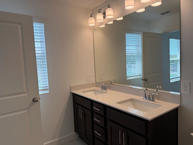 Elegant dual sink vanity in primary bath