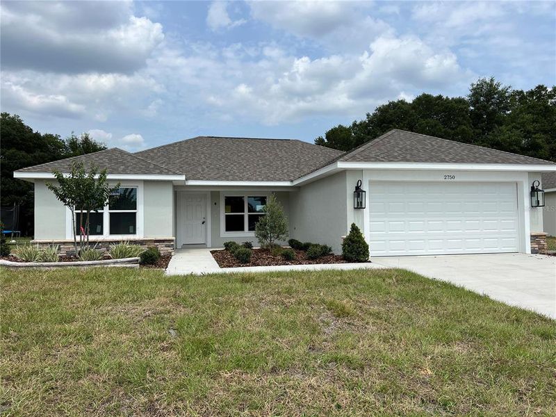 Front exterior of a new home in , Bushnell, FL, highlighting curb appeal (Image 1). Front exterior of a new home in , Bushnell, FL, highlighting curb appeal (Image 1).