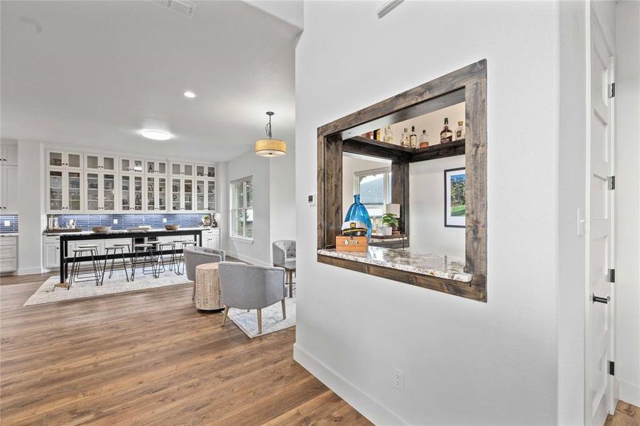 Hall with recessed lighting and dark wood-style flooring