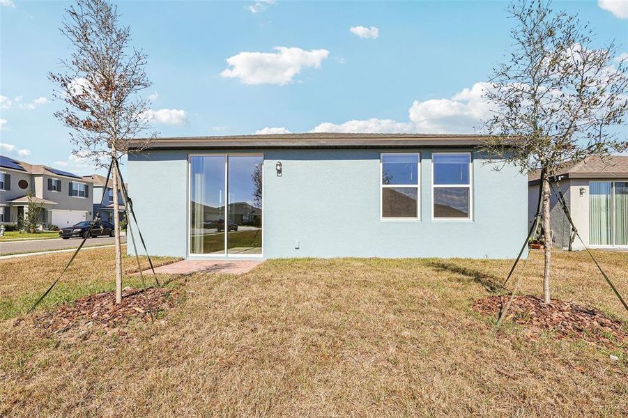 Exterior details and patio area of a home in Lake Deer Estates - Classic Series, Poinciana (Image 3).