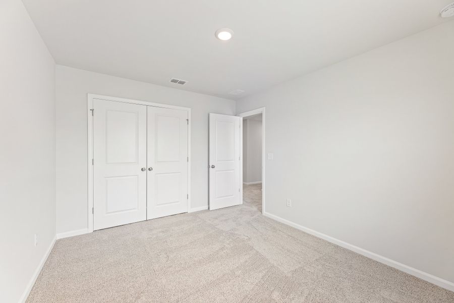 A hallway with white doors. A hallway with white doors.