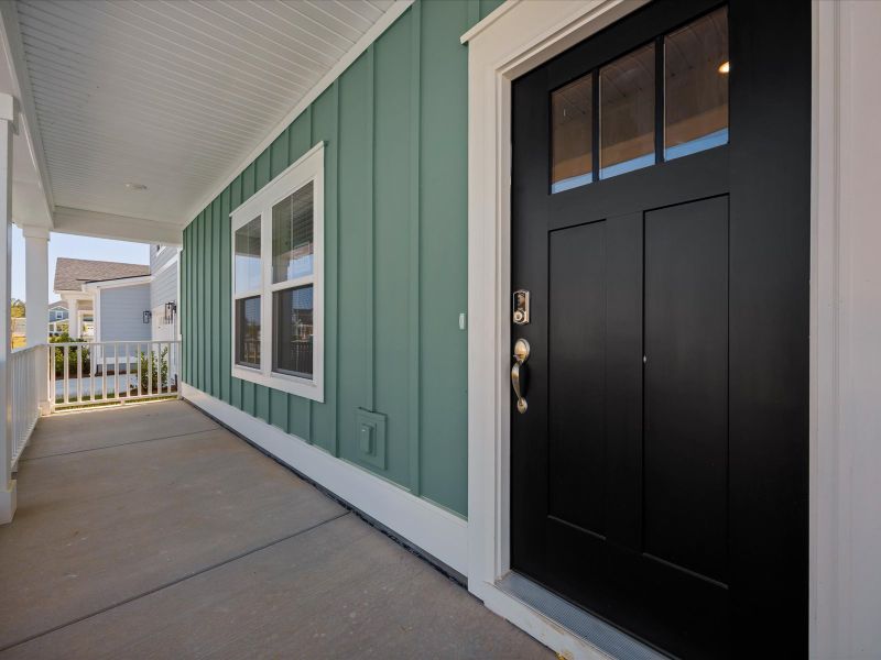 Exterior details and patio area of a home in The Coves at Lakes of Cane Bay II, Summerville (Image 2). Exterior details and patio area of a home in The Coves at Lakes of Cane Bay II, Summerville (Image 2).