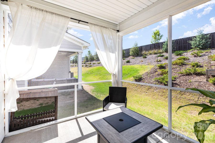 Exterior details and patio area of a home in Village at North Reach, Charlotte (Image 27).