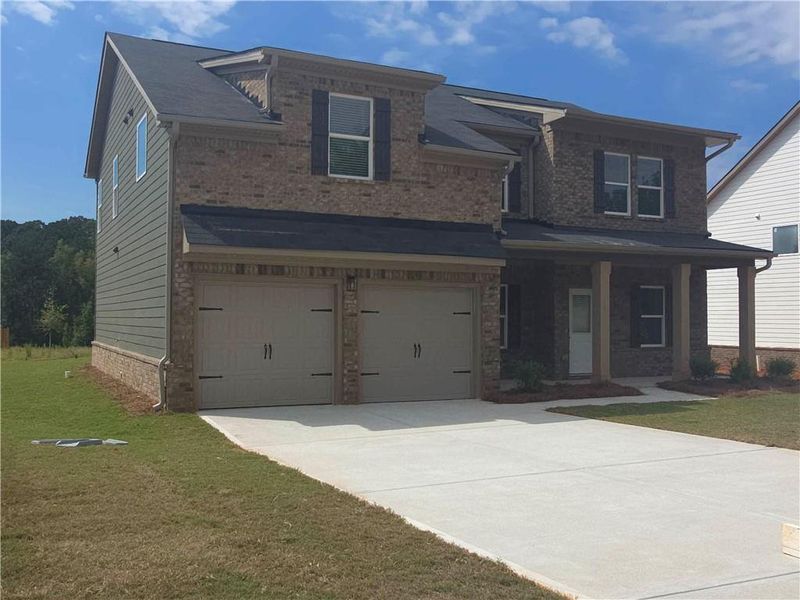 Front exterior of a new home in Southern Hills, McDonough, GA, highlighting curb appeal (Image 16).