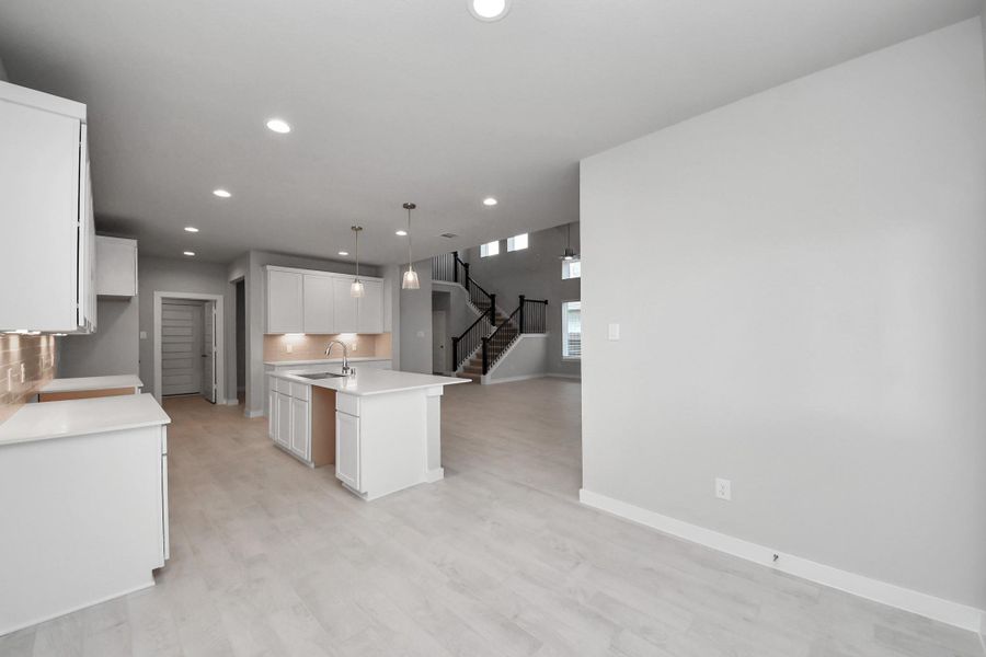 Enjoy breakfast with ease in the connected and cozy breakfast area, seamlessly integrated with the kitchen for utmost convenience. Step through the back door for a breath of fresh air onto the covered patio, extending your living space to the outdoors