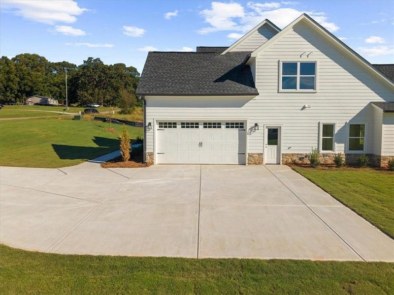 Front exterior of a new home in , Cumming, GA, highlighting curb appeal (Image 30).