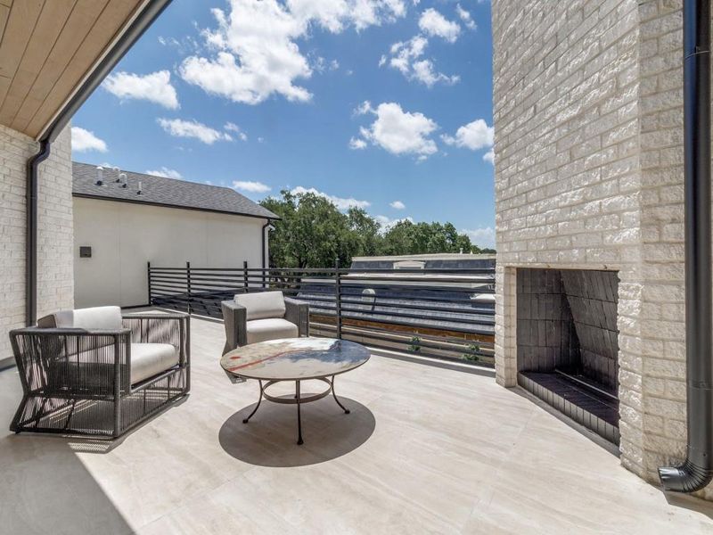 Outdoor living at it's best on a balcony with a fireplace Outdoor living at it's best on a balcony with a fireplace