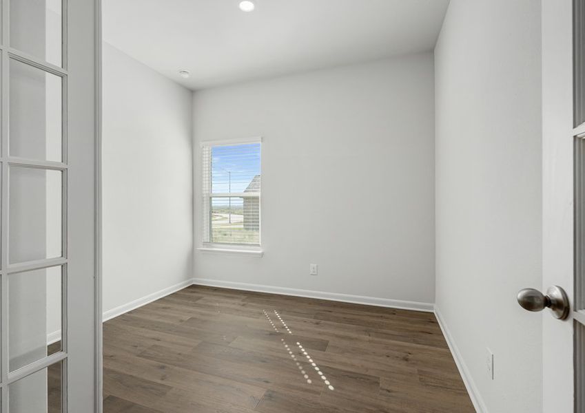 The flex room sits off of the living room and is a versatile space.