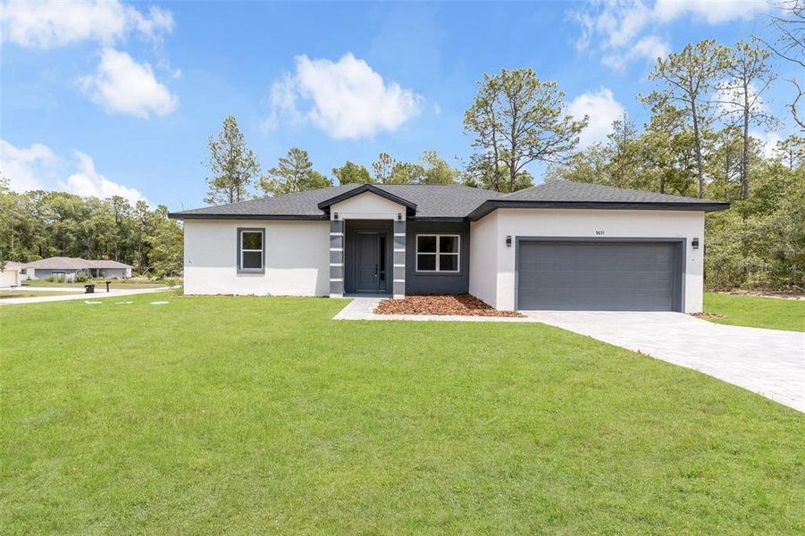 Front exterior of a new home in , Dunnellon, FL, highlighting curb appeal (Image 29).