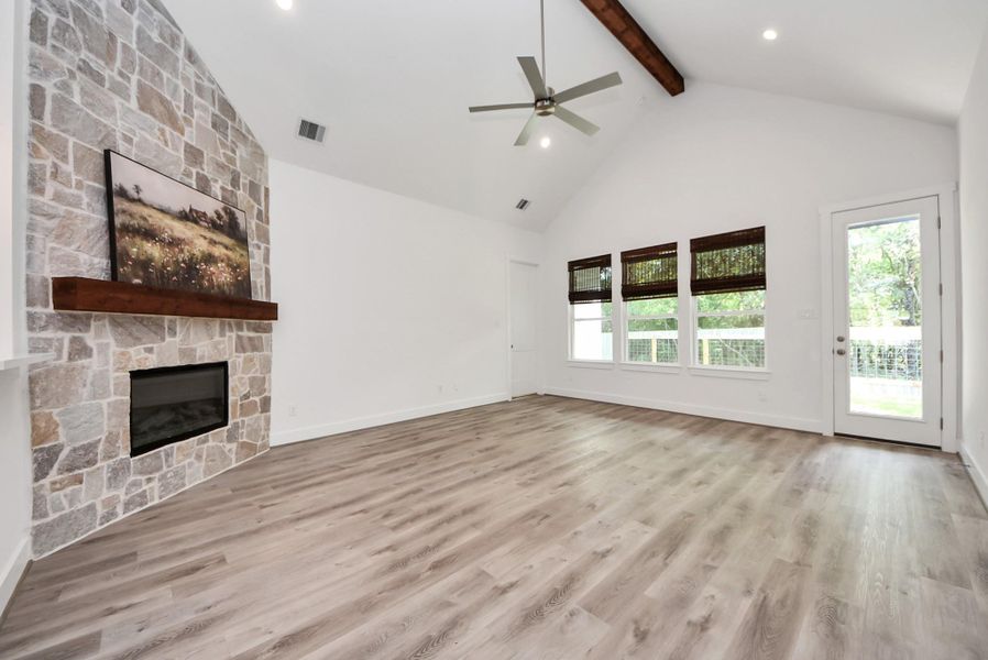 Spacious living area ideal for relaxing or entertaining guests with high ceilings.