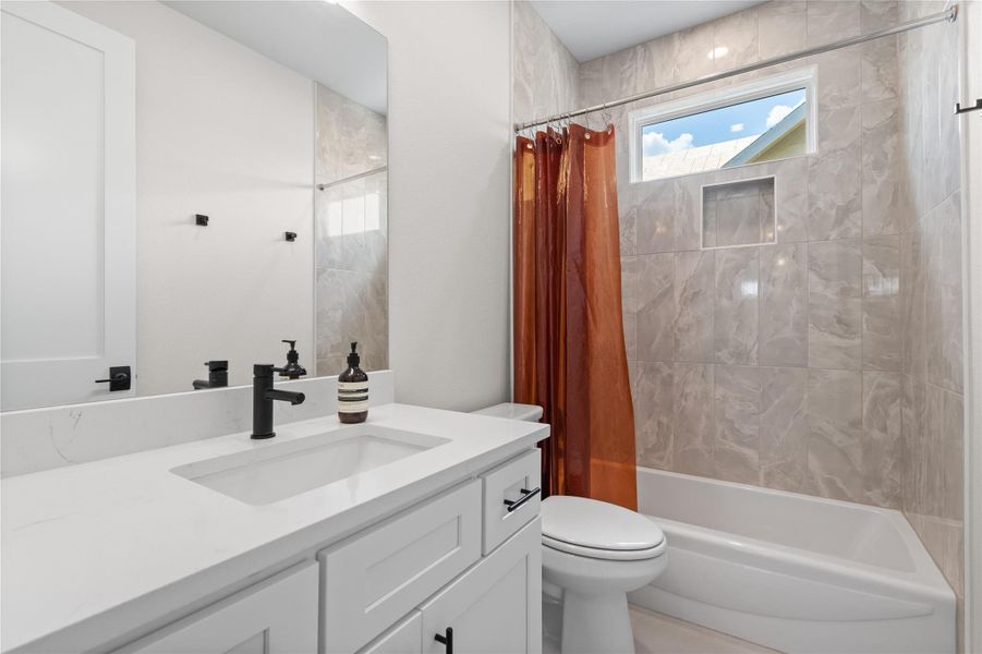A well-appointed bathroom features a bright vanity with a sleek faucet and a tiled shower with a window. A well-appointed bathroom features a bright vanity with a sleek faucet and a tiled shower with a window.