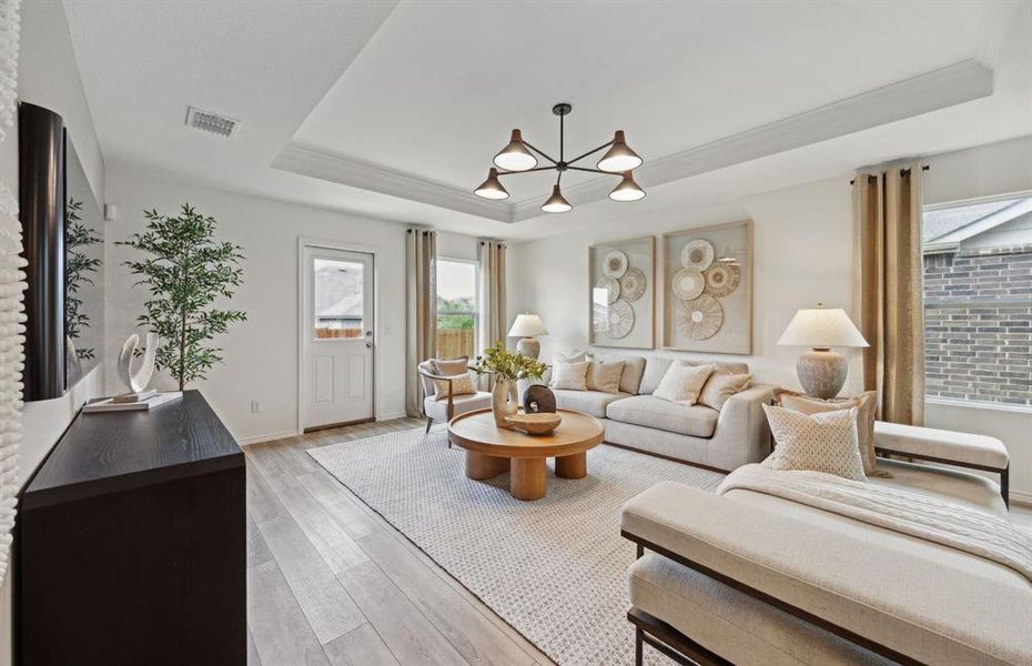 Expansive gathering room bathed in natural sunlight *Model representation