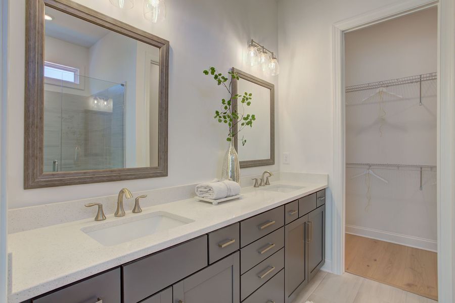 The master bathroom features dual vanity sinks